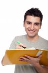 Man Studying With Dossier Stock Photo