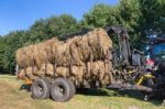 Agricultural Vehicle Filled With Round Hay Bales Stock Photo