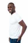 African Man Standing With His Hands In Pocket Stock Photo