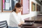 Portrait Of Thai Adult Businesswoman Beautiful Girl Using Computer Notebook Stock Photo