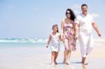 Family Walking By The Sea Stock Photo