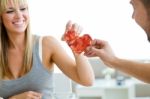 Couple Making Heart Sign With Two Slices Of Bread With Jam Stock Photo