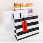 Shopping Bags With Red Sale Tag Stock Photo