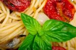 Spaghetti Pasta With Baked Cherry Tomatoes And Basil Stock Photo