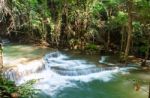 The Water Flowing Over Rocks And Trees Down A Waterfall At Huay Mae Khamin Waterfall National Park ,kanchana Buri In Thailand Stock Photo