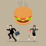 Business People Run Away From Hamburger Crisis Stock Photo