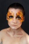 Orange And Red Rhinestones On A Girl Face Stock Photo