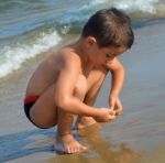 Boy On The Beach Stock Photo