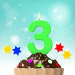 Three Candle On Cupcake Shows Toddler Birthday Party Or Celebrat Stock Photo