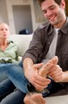 Man Massaging Womans Feet Stock Photo