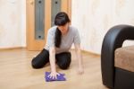 Woman Cleaning The Floor With A Cloth Stock Photo