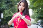 Portrait Of Thai Teen Beautiful Girl In Chinese Dress, Relax And Smile Stock Photo