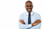 Smiling Young Guy Hanging Headphones In His Neck Stock Photo