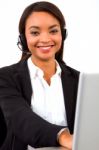 Businesswoman With Headset And Pc Stock Photo