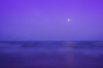 Calm Sea And Full Moon Sky Stock Photo