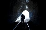 Man Standing In Train Tunnel Stock Photo