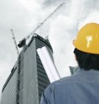 Workman At Construction Site Stock Photo