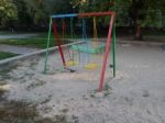 Children Playground, Swing Near The House  Stock Photo