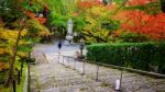 Guanyin Statue And Autumn Garden At Eikando, Kyoto Stock Photo