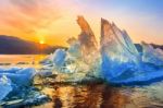 Very Large And Beautiful Chunk Of Ice At Sunrise In Winter Stock Photo