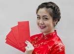 Chinese Woman Holding Red Envelopes Stock Photo