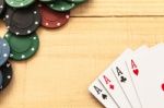 Cards And Poker Chips On Wooden Background Stock Photo