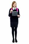 Cute School Girl With A Clapperboard Stock Photo