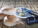 Burger Bun Bread Garlic And Pepper Crushed On Top Wood Table Stock Photo