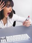 Shocked Woman Holding Calculator Stock Photo