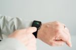 Businessman Checking His Daily Activities Using The Apple Watch Stock Photo