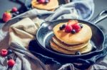 Home Made Pancakes With Berries On Metal Frying Pan Decorated Wi Stock Photo