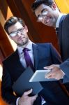 Businessmen With Digital Tablet  In Modern Office Stock Photo