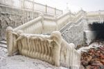 Ice Covered Staircase On The Beach Stock Photo