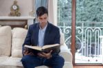 Young Man Reading A Book Stock Photo