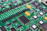 Circuit Board With Electronic Components Background Stock Photo