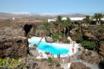 People Walking Round The Swimming Pool At Jameos Del Agua In Lan Stock Photo