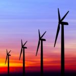 Wind Turbine Silhouette On Colorful Sunset Stock Photo