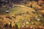 Sunny Spring In Mountain Village. Fields And Hills Stock Photo