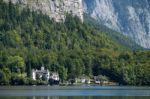 Castle Schloss On The Shoreline Of Lake Hallstatt Stock Photo