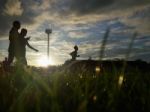 Silhouette  Running On Road At Sunrise Stock Photo