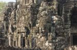 Ancient Stone Faces Of King Jayavarman Vii At The Bayon Temple, Stock Photo