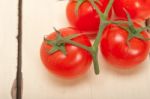 Fresh Cherry Tomatoes On A Cluster Stock Photo