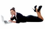 Relaxed Corporate Woman Working On Laptop Stock Photo