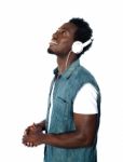 African guy Listening Music Stock Photo