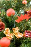 Christmas Tree Decorated With Red Balls And Gifts Stock Photo