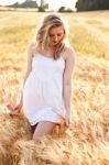 Portrait Of Beautiful Girl In Field Stock Photo