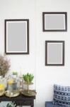 Room Interior With Frames On White Wall Stock Photo