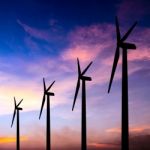 Wind Turbine Silhouette On Colorful Sunset Stock Photo