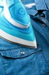 Ironing Denim Shirt Stock Photo