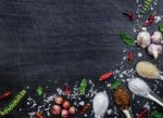 Top View Of Food Ingredients And Condiment On The Table, Ingredients And Seasoning On Dark Wooden Floor Stock Photo